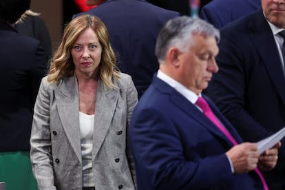 Italian Prime Minister Giorgia Meloni stands next to Hungarian Prime Minister Viktor Orbán at a NATO meeting in Washington, July 11.