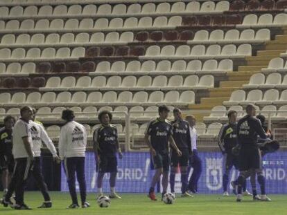 Real Madrid players warming up in the semi-darkness of Ray Vallecano&#039;s stadium on Sunday night.