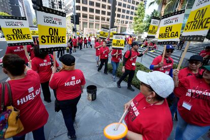 Striking hotel workers rally outside the Intercontinental Hotel after walking off their job early Sunday, July 2, 2023, in downtown Los Angeles.