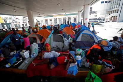 Haitian asylum seekers set up camp in an abandoned gas station while they wait to attempt to cross into the U.S. by an appointment through the Customs and Border Protection app, called CBP One, at a makeshift camp, in Matamoros, Mexico June 21, 2023.