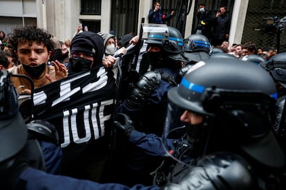 French police confront protesters occupying a street in front of Sciences Po University in Paris in support of Palestinians, on April 26, 2024. 