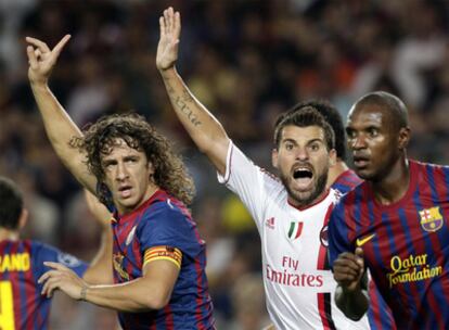 Puyol y Abidal, ante el Milán.