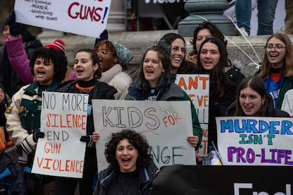 Demonstrators hold signs during an anti-gun violence rally in Boston, Massachusetts, on March 25, 2023