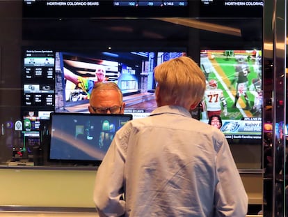 A customer, right, makes a sports bet at the Ocean Casino Resort in Atlantic City, N.J., Monday, Feb. 6, 2023.