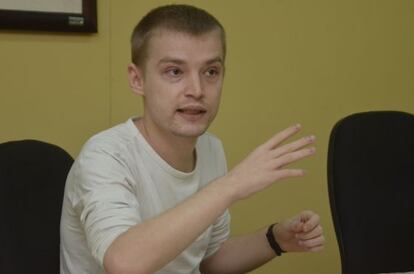 Maxim Chukharev, a suspect in the Liberty Reserve case, speaks to a reporter.