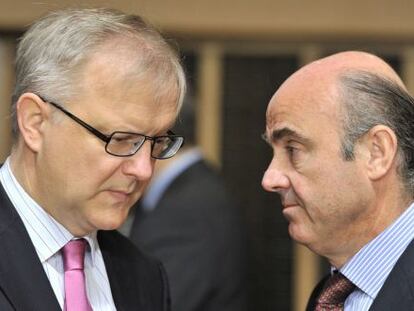 Luis de Guindos y Olli Rehn, presidente del Eurogrupo