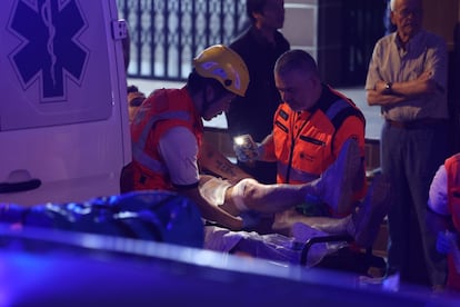 Emergency services treat an injured person in Playa de Palma after a building collapse.