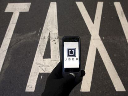 An Uber user next to a taxi lane in Madrid in December 2014.