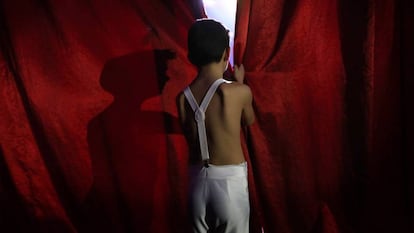 A child performer waits his turn to go into the ring at Gottani Circus.