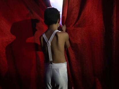 A child performer waits his turn to go into the ring at Gottani Circus.