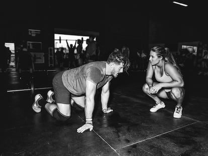 Cross training athletes resting and chatting in gym