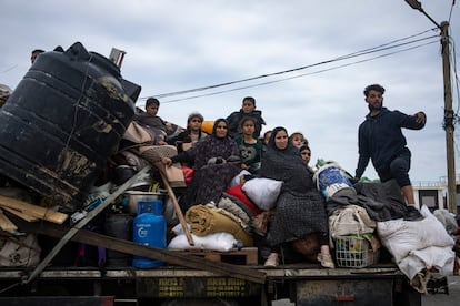 Palestinians arrive in the southern Gaza town of Rafah after fleeing an Israeli ground and air offensive in the nearby city of Khan Younis on Friday, Jan. 26, 2024