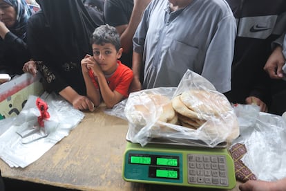 Palestinians wait to buy bread during the ongoing bombardment of the Gaza Strip in Rafah on Sunday, Oct. 29, 2023.