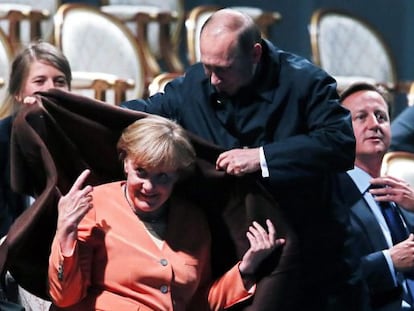 Putin cubre a Merkel, durante un espect&aacute;culo en el G20.