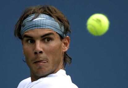 Rafa Nadal returns during his first round match against Ryan Harrison.