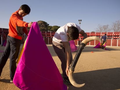 Two students practicing at the Madrid bullfighting school.