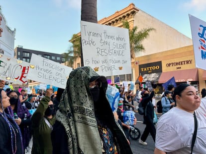 On Tuesday, the protesters held a poster while listening to the community organizers in front of the former Orange County Court in Santa Ana.