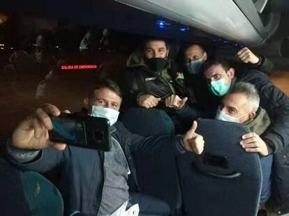 Spaniards evacuated from Wuhan during their bus journey to a Madrid hospital.