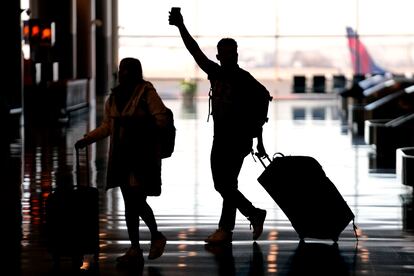 People pass through Salt Lake City International Airport on January 11, 2023, in Salt Lake City.