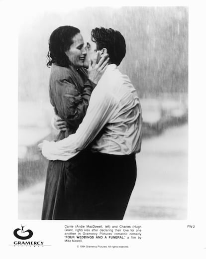 Andie MacDowell and Hugh Grant kiss in the rain, one of the scenes from 'Four Weddings and a Funeral'.