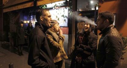 Smokers outside a Madrid bar.