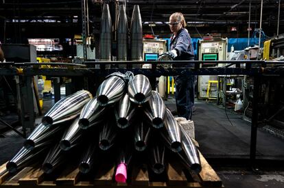 A steel worker moves a 155 mm M795 artillery projectile during the manufacturing process at the Scranton Army Ammunition Plant in Scranton, Pa., Thursday, April 13, 2023.