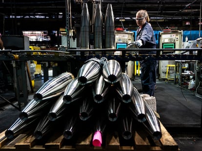 A steel worker moves a 155 mm M795 artillery projectile during the manufacturing process at the Scranton Army Ammunition Plant in Scranton, Pa., Thursday, April 13, 2023.