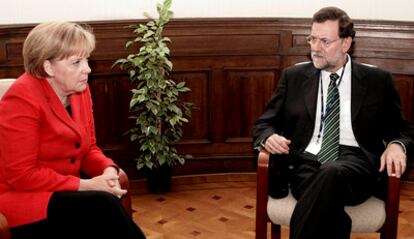 Rajoy, durante una reunión con la canciller Angela Merkel en Bruselas el año pasado.