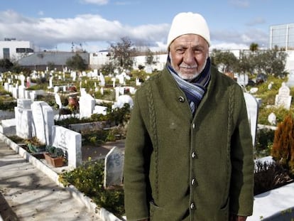 Imam Mohamed Bernaui next to Muslim graves in Griñón cemetery.