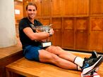 A handout photograph taken and released on October 11, 2020 by the Federation Francaise de Tennis (FFT) shows Spain's Rafael Nadal posing with The Mousquetaires Cup - The Musketeers in the locker room after winning the men's singles final tennis match against Serbia's Novak Djokovic at the Philippe Chatrier court, on Day 15 of The Roland Garros 2020 French Open tennis tournament in Paris. (Photo by Julien Crosnier / FFT - FEDERATION FRANCAISE DE TENNIS / AFP) / RESTRICTED TO EDITORIAL USE - MANDATORY CREDIT "AFP PHOTO / FEDERATION FRANCAISE DE TENNIS (FFT) / JULIEN CROSNIER " - NO MARKETING - NO ADVERTISING CAMPAIGNS - DISTRIBUTED AS A SERVICE TO CLIENTS
