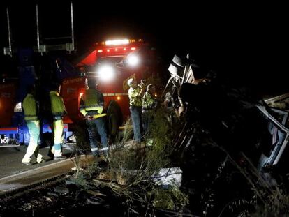 Civil Guard officers examine the overturned vehicle.