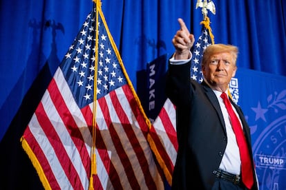 Republican presidential candidate, former U.S. president Donald Trump, points to supporters at the conclusion of a campaign rally in Atkinson, New Hampshire.