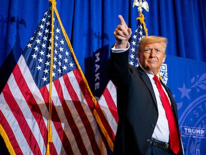 Republican presidential candidate, former U.S. president Donald Trump, points to supporters at the conclusion of a campaign rally in Atkinson, New Hampshire.