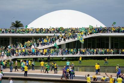 Supporters of Brazil's former president Jair Bolsonaro storm the National Congress building in Brasília, Brazil, Sunday, Jan. 8, 2023. 