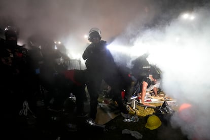Police enter an encampment set up by pro-Palestinian demonstrators on the UCLA campus Thursday, May 2, 2024, in L.A.