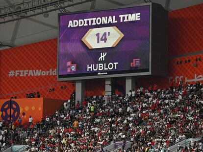 A screen displays the 14 minutes of first-half stoppage time during the game between England and Iran.
