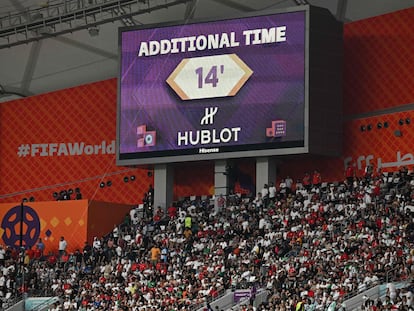 A screen displays the 14 minutes of first-half stoppage time during the game between England and Iran.