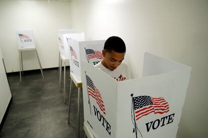 In this Oct. 23, 2018 file photo, Christian Goodman votes at the Los Angeles County Registrar of Voters office, Oct. 23, 2018, in Norwalk, Calif.