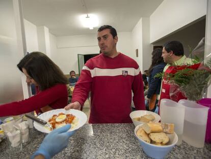 Antonio Luque, an unemployed electrician, stands in line at a soup kitchen in Ja&eacute;n.