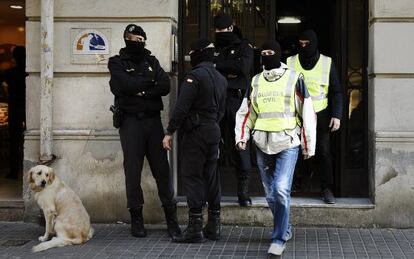 Police carry out a raid in Barcelona in October 2015.