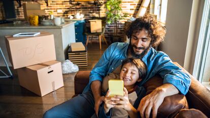 Close up of a father and son having a selfie in their new home