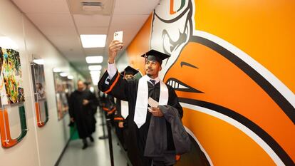 A student takes a selfie during graduation at the University of Miami in 2023.