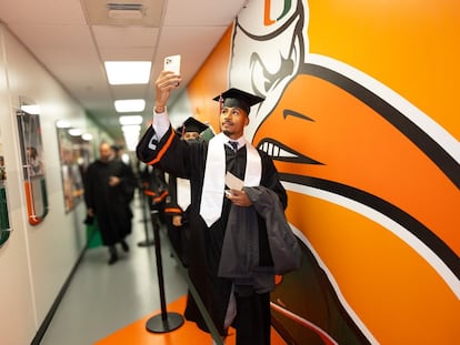 A student takes a selfie during graduation at the University of Miami in 2023.