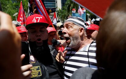 A supporter of former president Donald Trump and an anti-Trump demonstrator argue near the Wilkie D. Ferguson Jr. United States Courthouse on June 13, 2023.