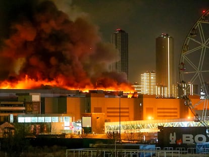 A massive blaze is seen over the Crocus City Hall on the western edge of Moscow, Russia, Friday, March 22, 2024.