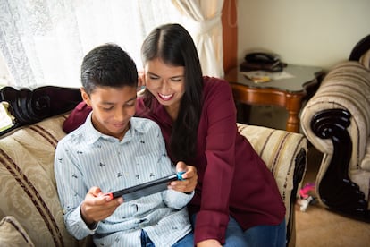 Mom playing video games with her son