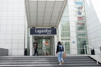 People enter the Lagardere News headquarters Tuesday, Aug. 1, 2023 in Paris.