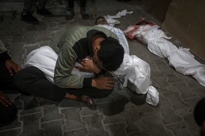 A Palestinian youth mourns his relative killed in the Israeli bombardment of the Gaza Strip