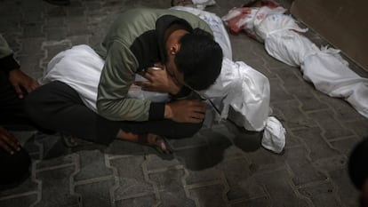 A Palestinian youth mourns his relative killed in the Israeli bombardment of the Gaza Strip