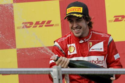 Fernando Alonso celebrates third place at the Turkish Grand Prix.